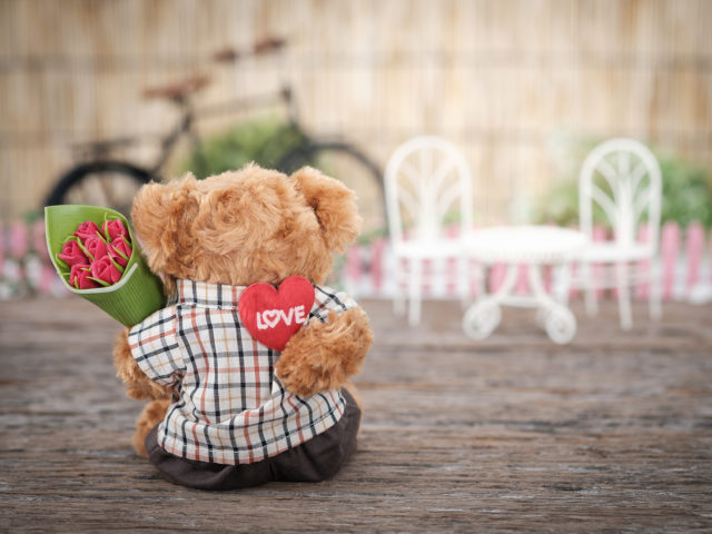 Bear Holding Roses