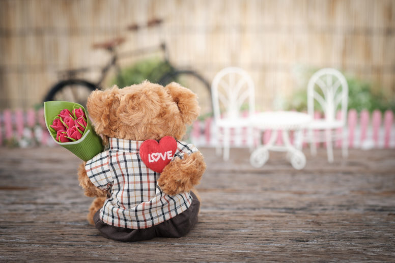 Bear Holding Roses